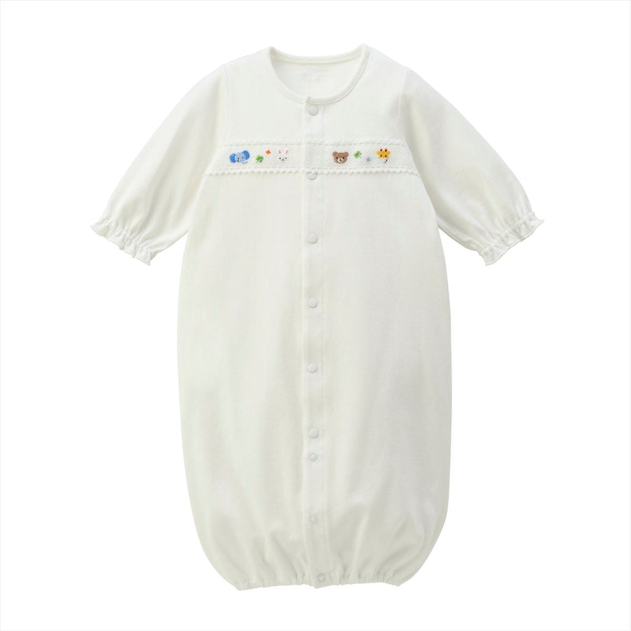 White newborn coverall in a gown-style fastening arrangement.