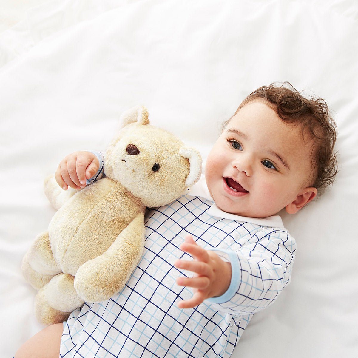 Baby hugging shop teddy bear