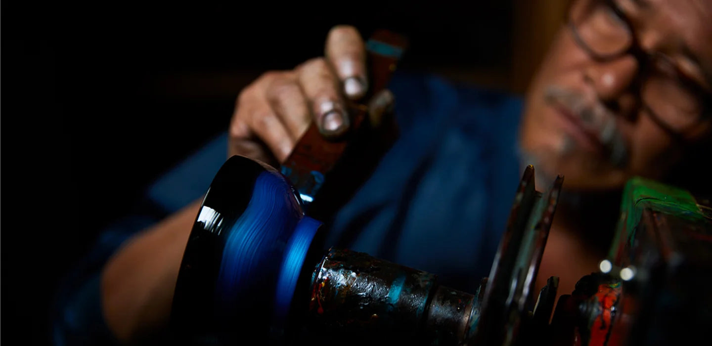 A Wajima craftsperson works on a lacquerware piece